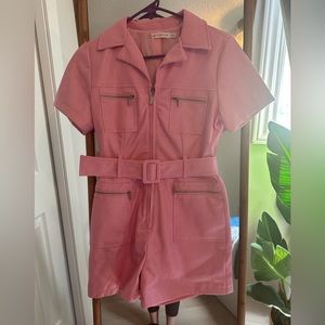 Light pink, very soft leather like material with a satin lining. EUC